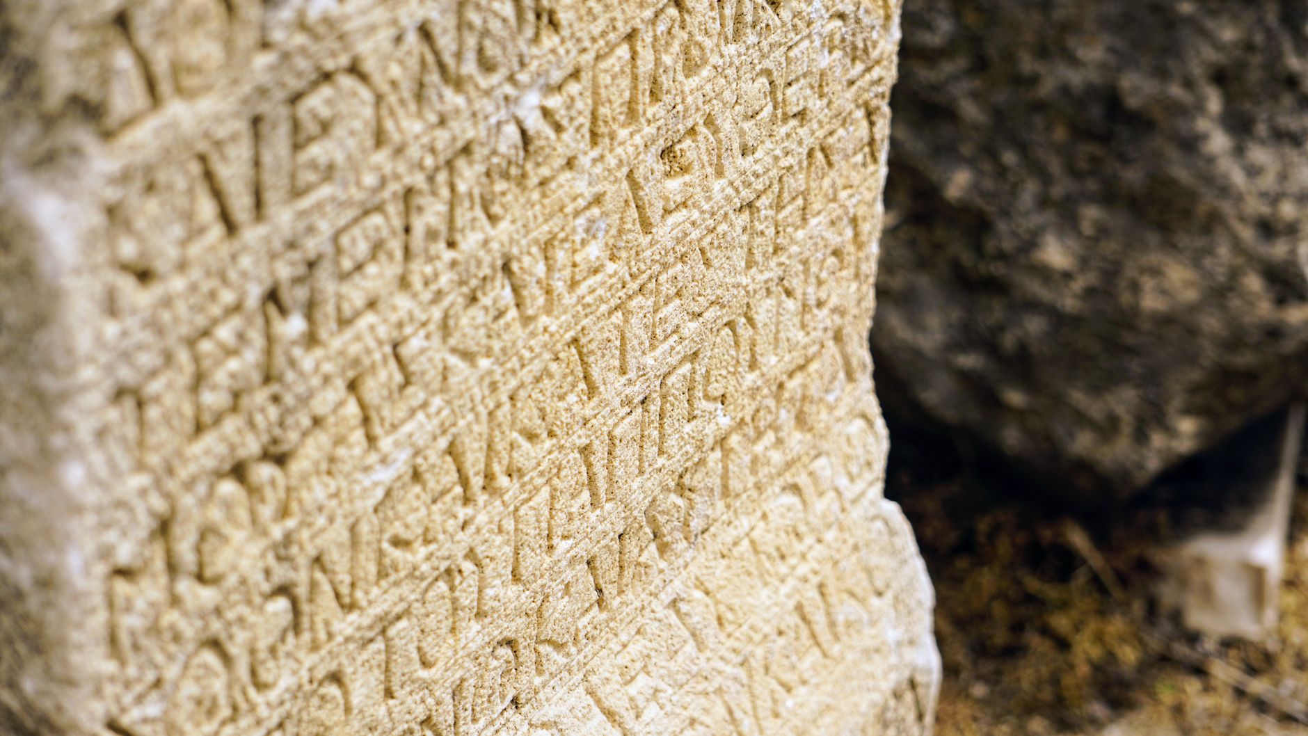 ancient text in stone